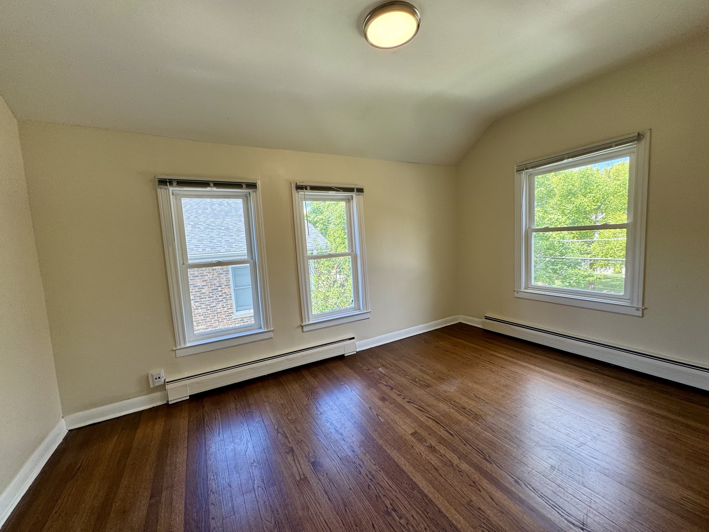 844 Deerfield Road, Unit 2 Highland Park, IL 60035 - Photo 12 of 18 an empty room with wooden floor and windows