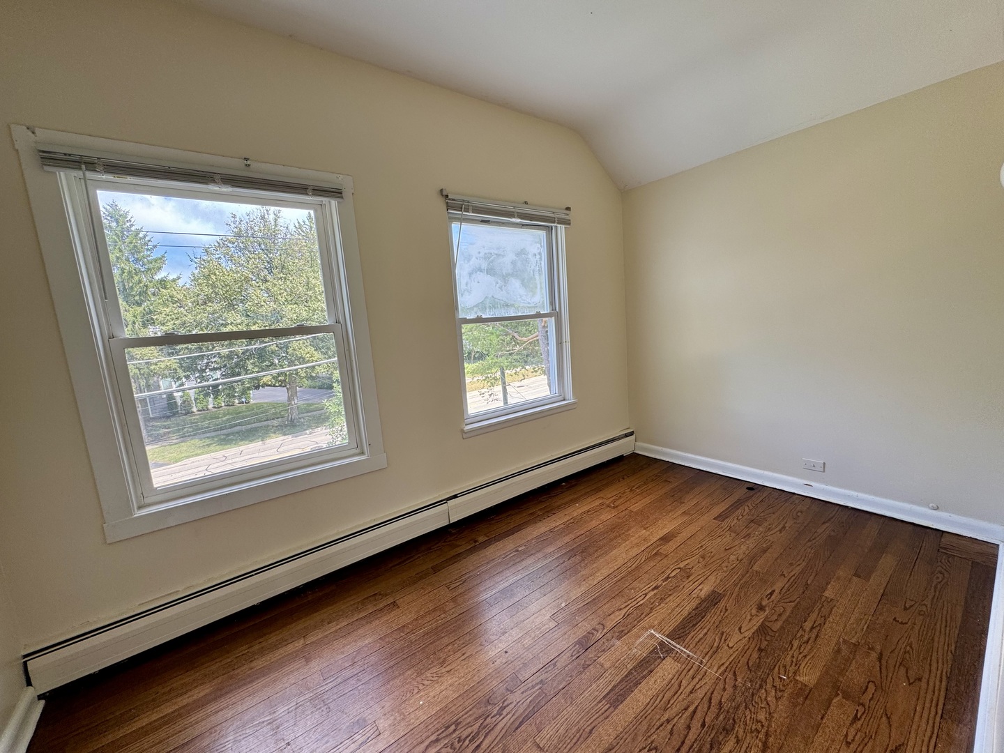 844 Deerfield Road, Unit 2 Highland Park, IL 60035 - Photo 13 of 18 a view of an empty room with wooden floor and a window