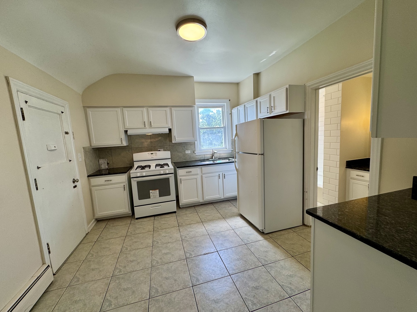 844 Deerfield Road, Unit 2 Highland Park, IL 60035 - Photo 7 of 18 a kitchen with a stove a refrigerator and a sink