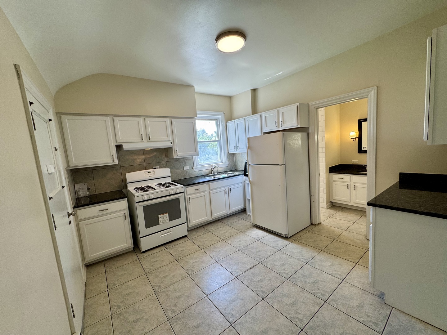 844 Deerfield Road, Unit 2 Highland Park, IL 60035 - Photo 8 of 18 a kitchen with a stove a refrigerator and a cabinets
