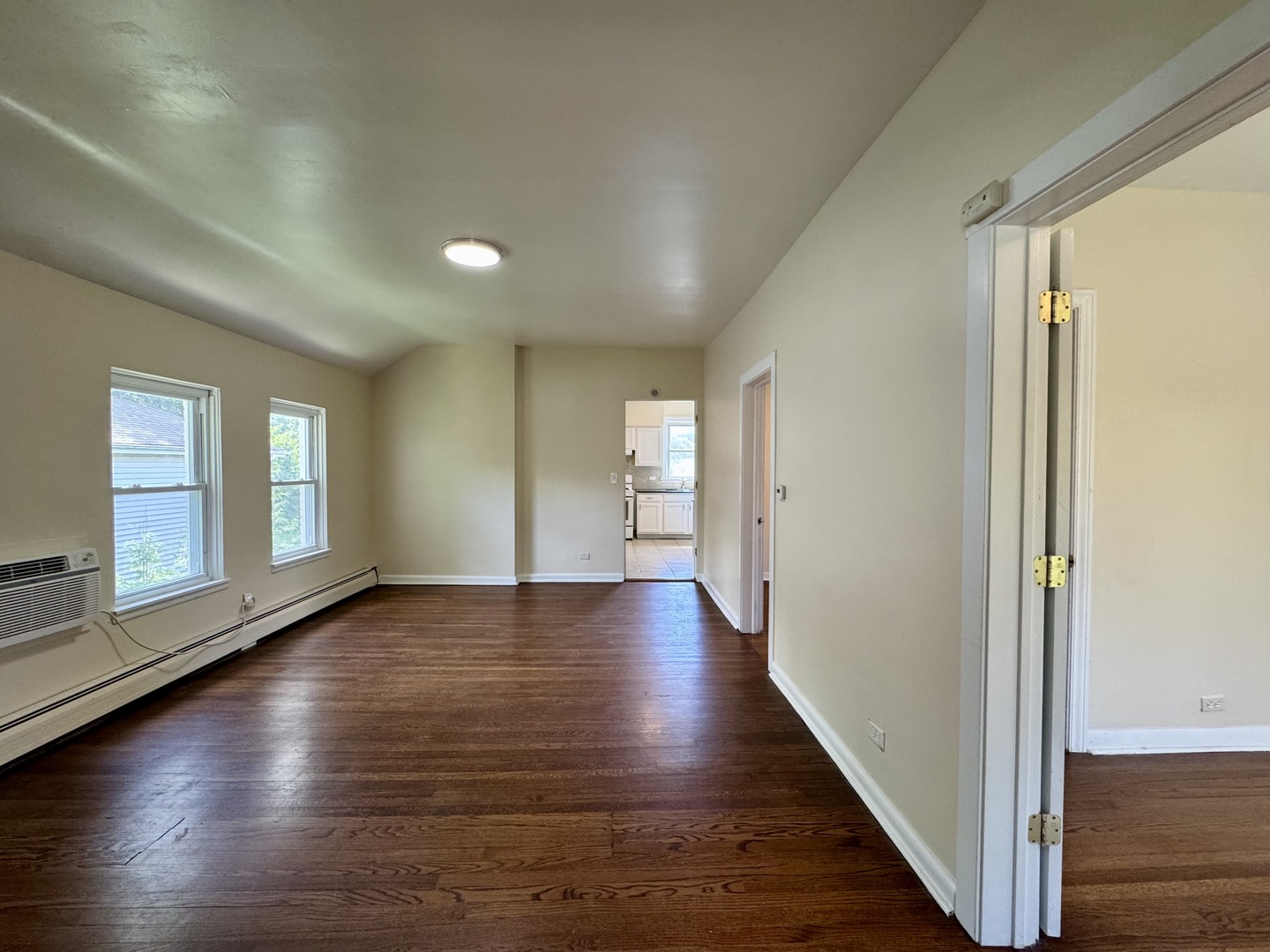 844 Deerfield Road, Unit 2 Highland Park, IL 60035 - Photo 10 of 18 a view of an empty room with wooden floor and a window