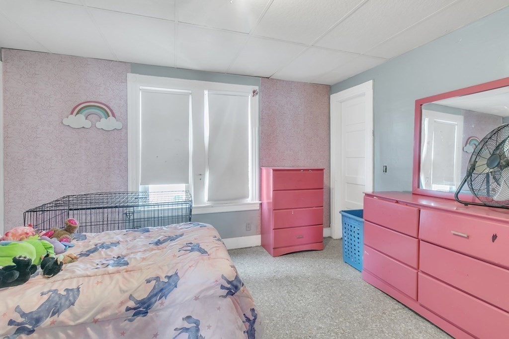 18 Porter Street Springfield, MA 01104 - Photo 13 of 42 a bedroom with a bed and a dresser