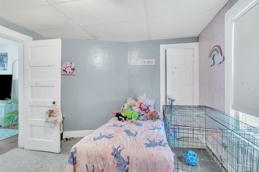18 Porter Street Springfield, MA 01104 - Photo 14 of 42 a bed room with a bed
