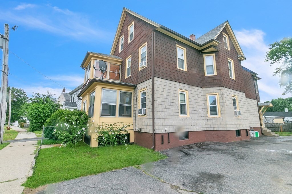 18 Porter Street Springfield, MA 01104 - Photo 2 of 42 a front view of a house with garden