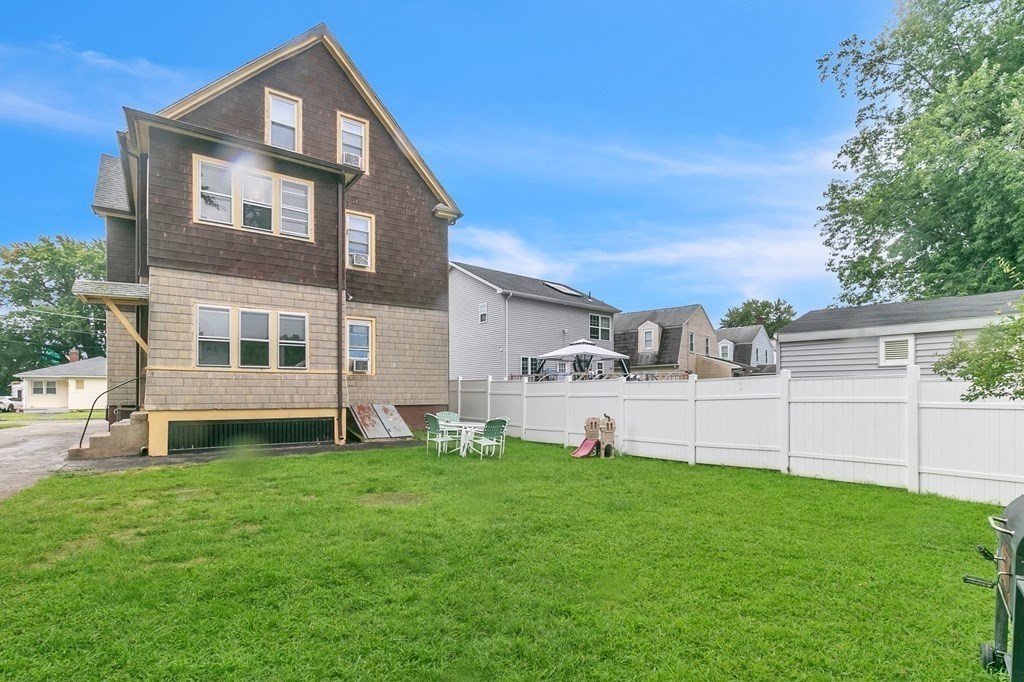 18 Porter Street Springfield, MA 01104 - Photo 3 of 42 a view of a house with a yard and sitting area
