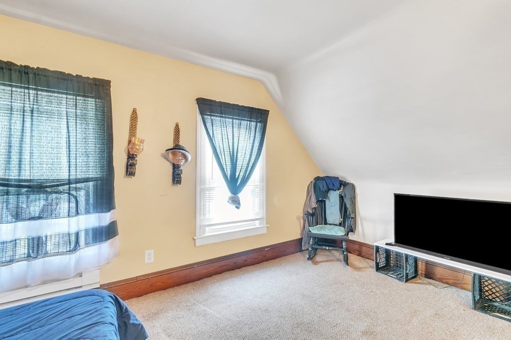 18 Porter Street Springfield, MA 01104 - Photo 35 of 42 a living room with furniture and a flat screen tv
