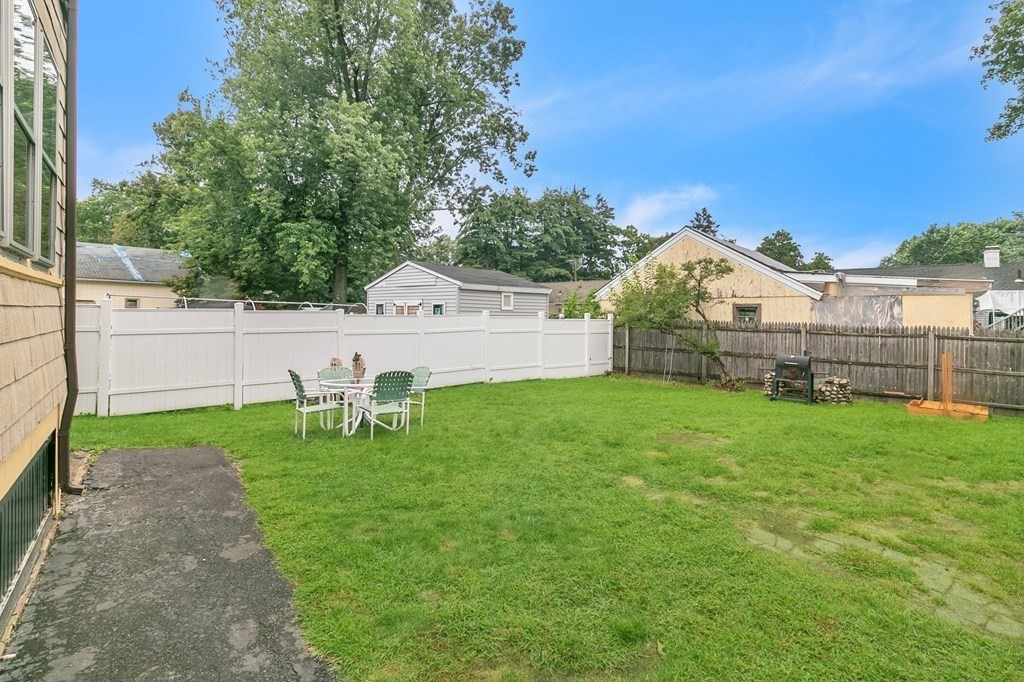 18 Porter Street Springfield, MA 01104 - Photo 5 of 42 a view of a house with a yard and sitting area