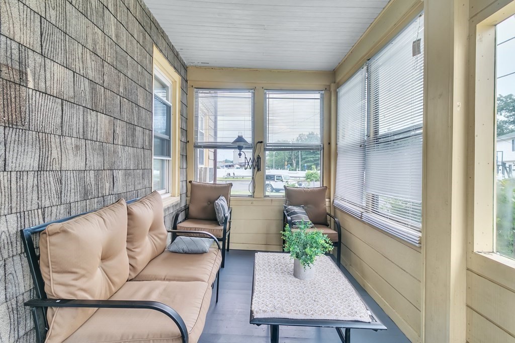 18 Porter Street Springfield, MA 01104 - Photo 7 of 42 a balcony with furniture and a potted plant