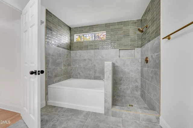 a bathroom with a shower and bathtub