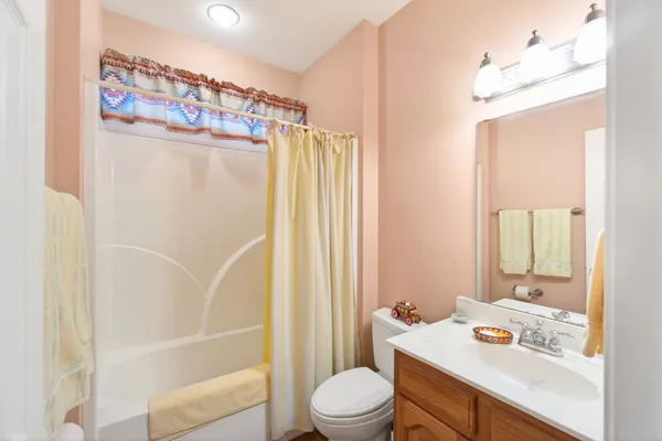 a bathroom with a sink toilet tub and shower