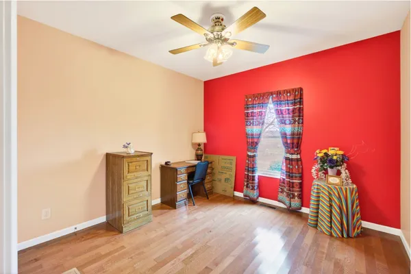 a view of a livingroom with furniture and an empty room