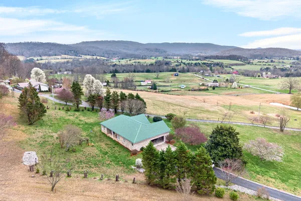 an aerial view of residential houses and outdoor space