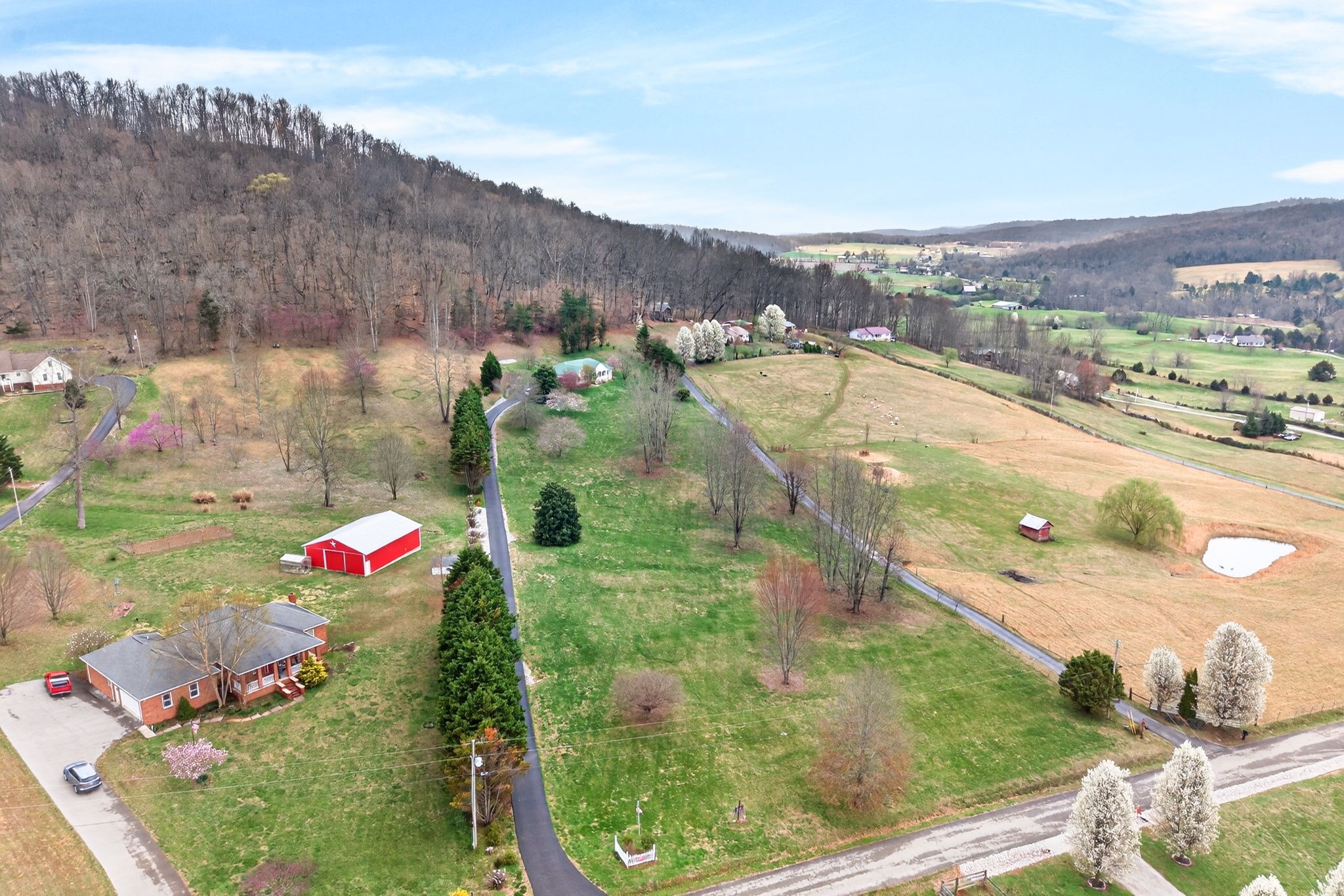 444 Mackie Road Sparta, TN 38583 - Photo 22 of 31 an aerial view of residential houses with outdoor space and swimming pool