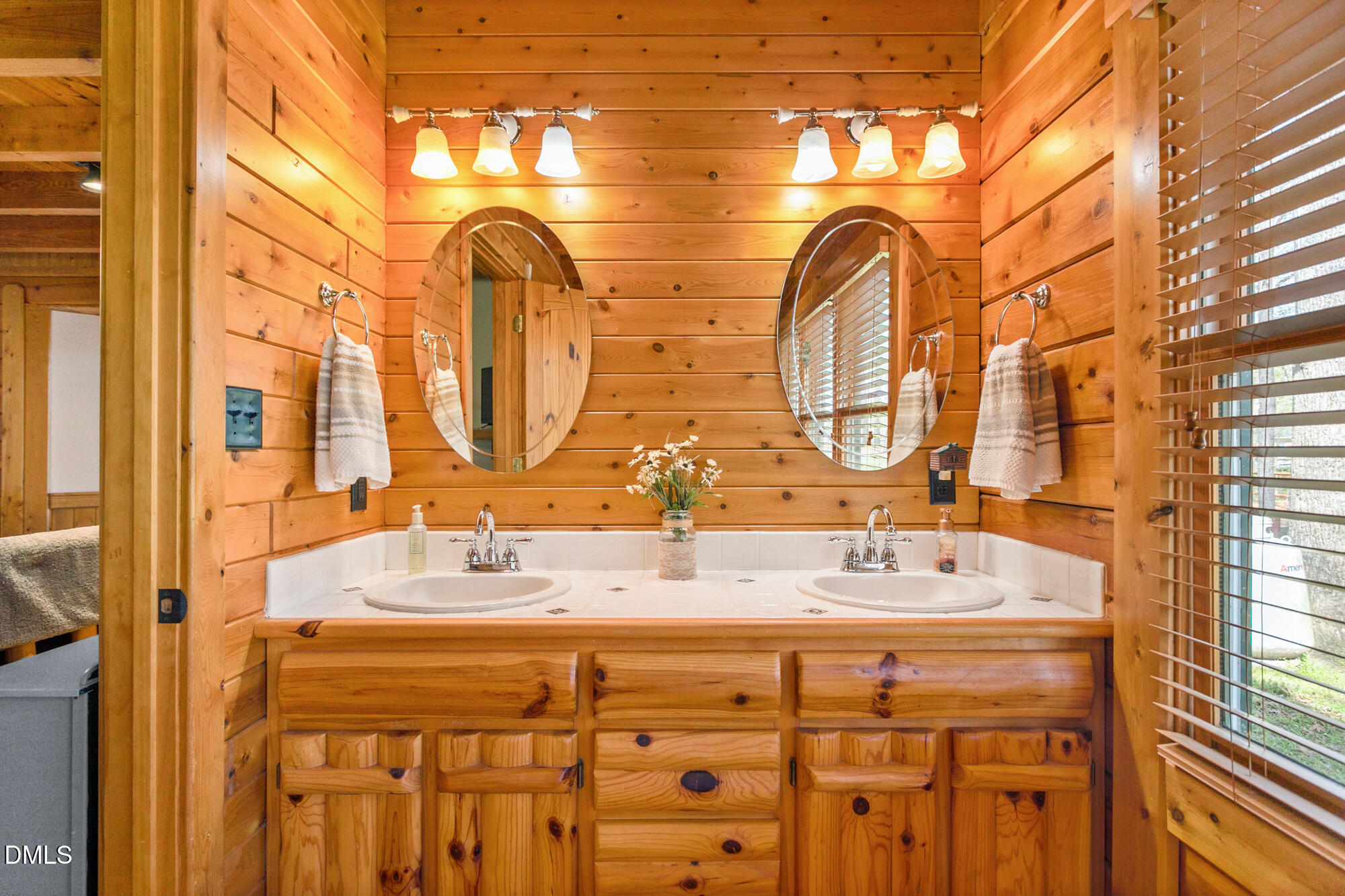 1750 Kerner Road Kernersville, NC 27284 - Photo 25 of 44 a bathroom with a double vanity sink and a mirror