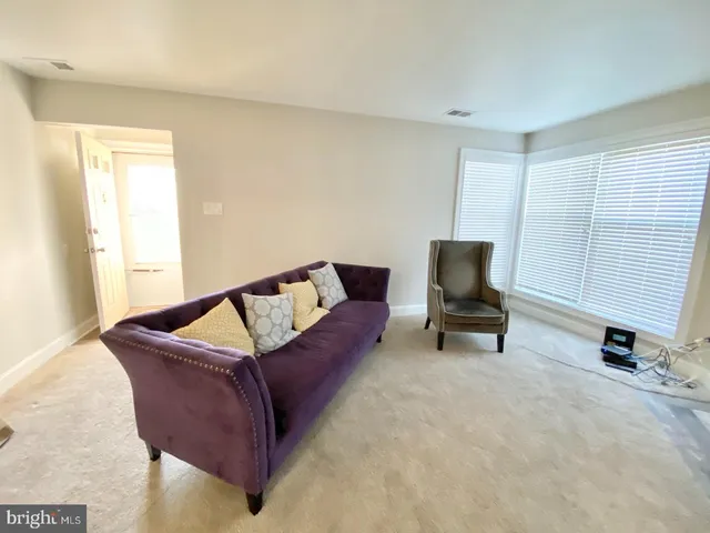 a view of entryway with a small yard