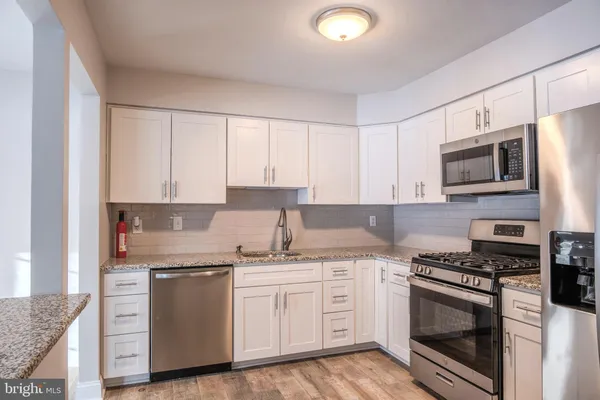 a view of a lake with couches chairs and a table