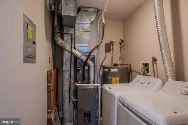 a front view of a house with a garden and yard