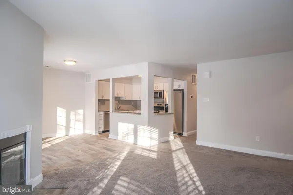 a view of hallway with wooden floor