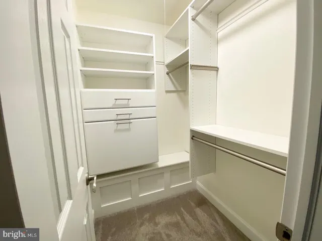 a view of a dining room with furniture and a window