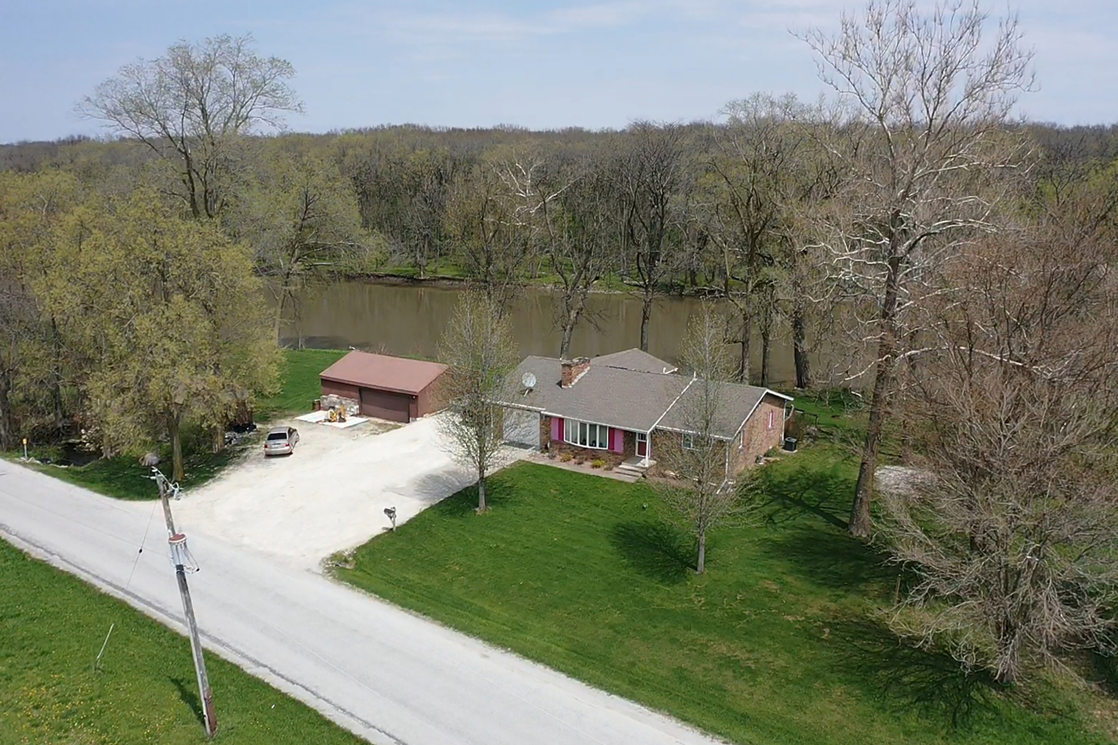 5585 River Road Kankakee, IL 60901 - Photo 1 of 30 a aerial view of a house with a yard and lake view