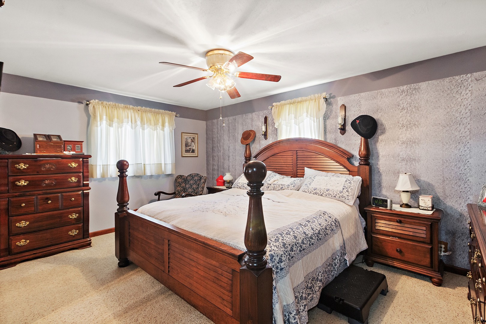 5585 River Road Kankakee, IL 60901 - Photo 14 of 30 a bedroom with a bed and a chandelier