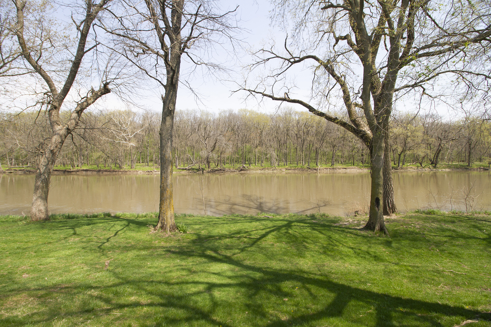 5585 River Road Kankakee, IL 60901 - Photo 20 of 30 a backyard of a house with lots of green space and lake view