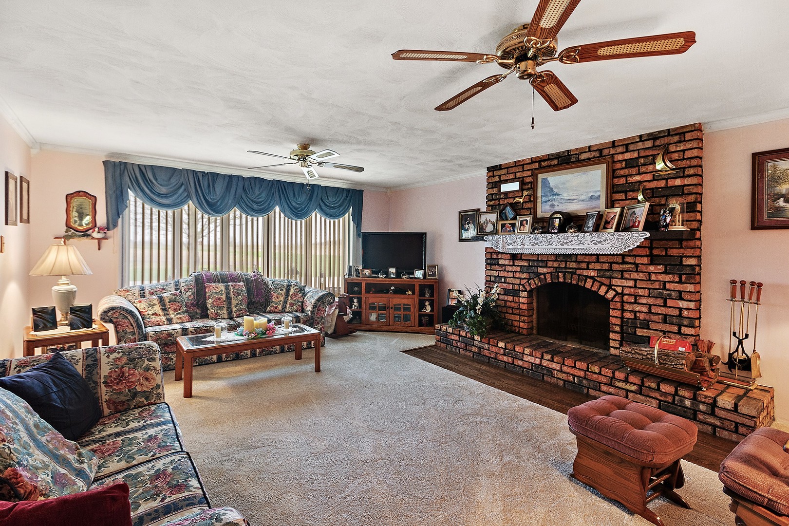 5585 River Road Kankakee, IL 60901 - Photo 3 of 30 a living room with furniture a fireplace and a flat screen tv