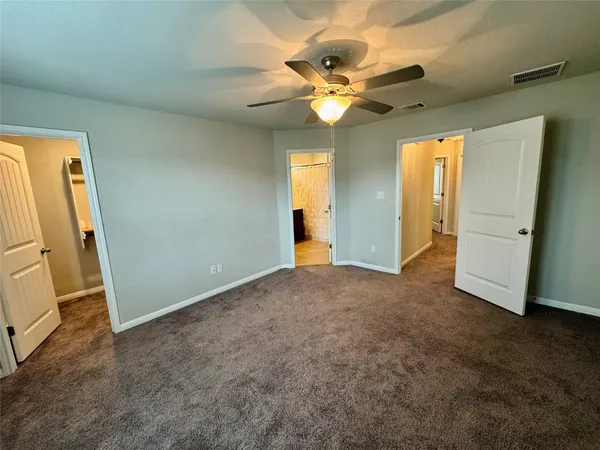 a bathroom with a shower and a sink