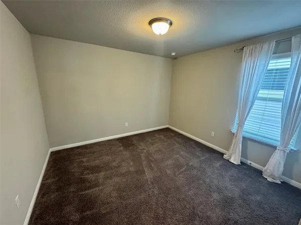 a bathroom with a sink a mirror a toilet and vanity