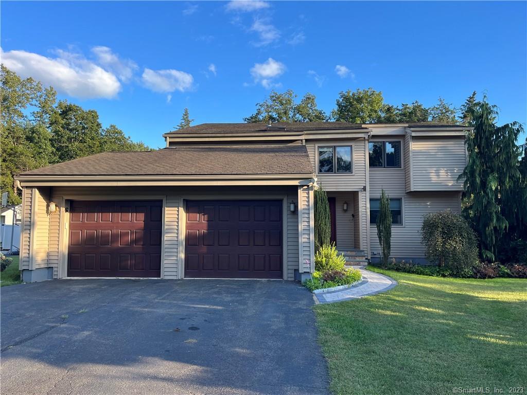 125 Crest Road Southington, CT 06489 - Photo 1 of 1 a view of a house with a yard and garage