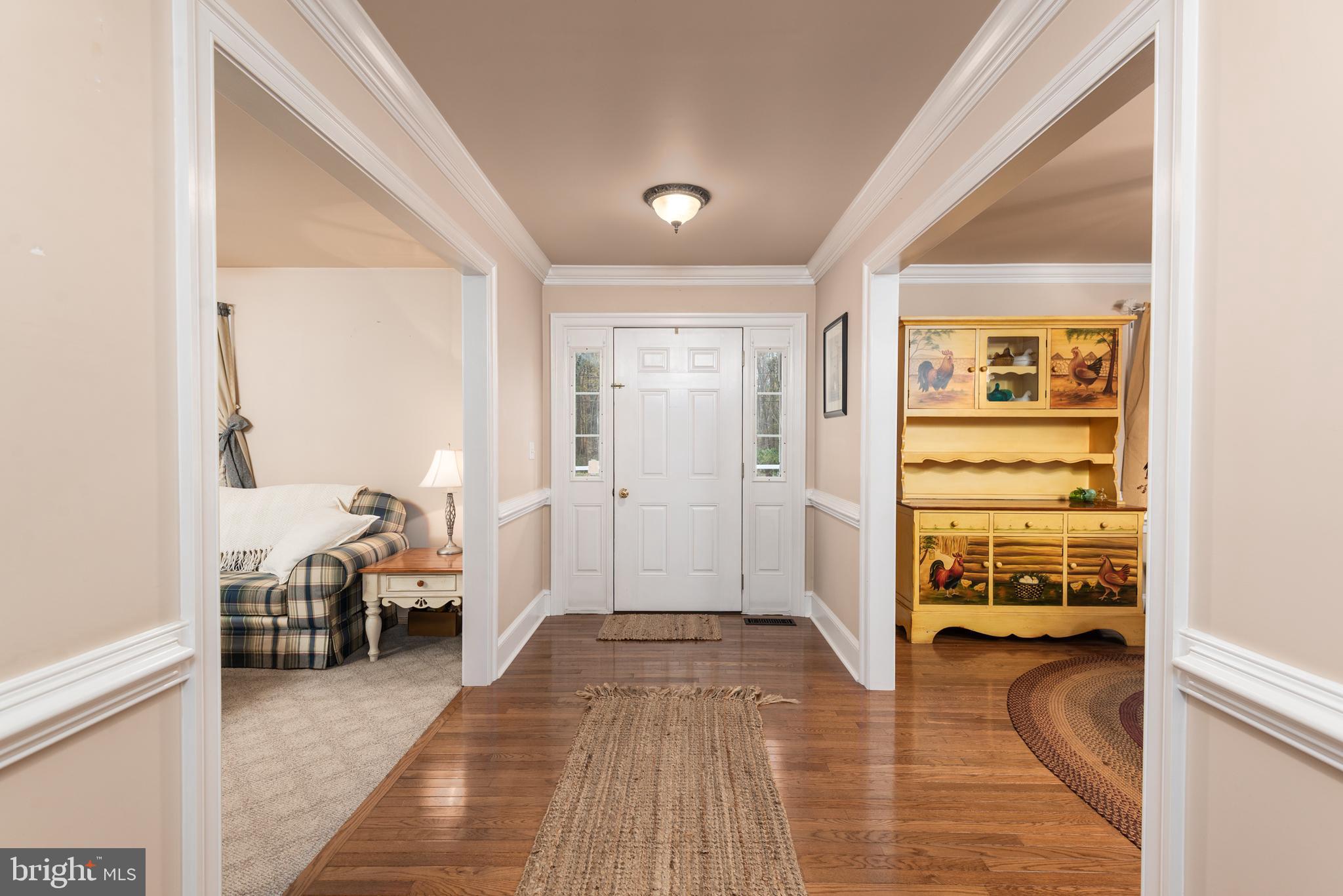1002 Burrisville Road Centreville, MD 21617 - Photo 16 of 50 a view of a bedroom with furniture and windows