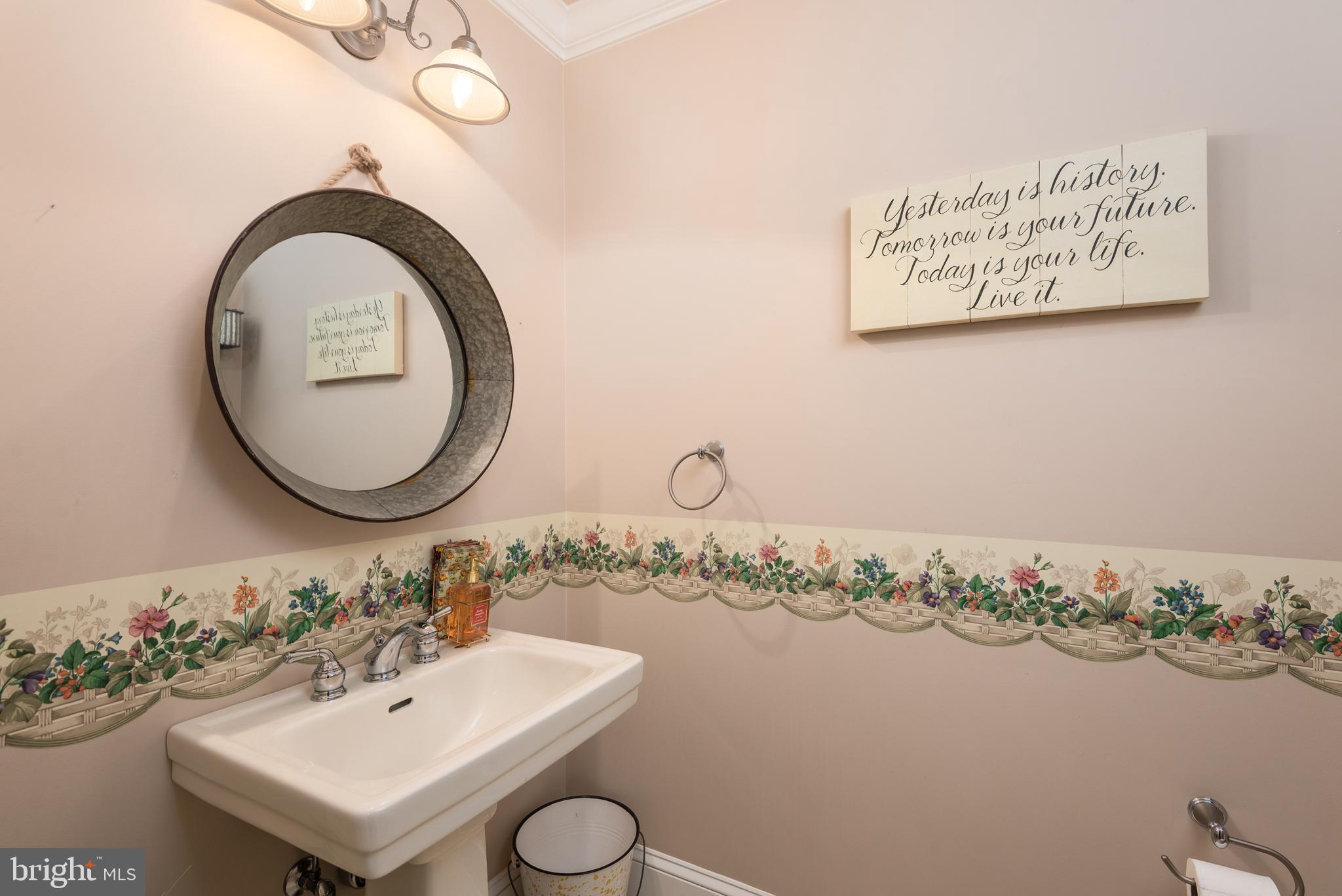 1002 Burrisville Road Centreville, MD 21617 - Photo 19 of 50 a bathroom with a sink and a mirror