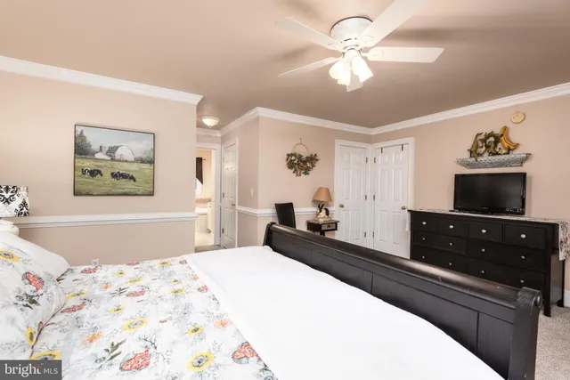 a bathroom with a granite countertop bathtub a sink and a window
