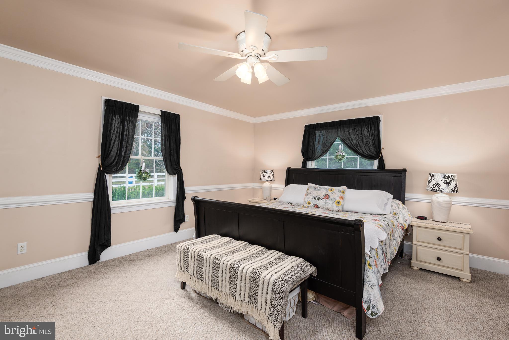 1002 Burrisville Road Centreville, MD 21617 - Photo 30 of 50 a bedroom with a bed and a dresser