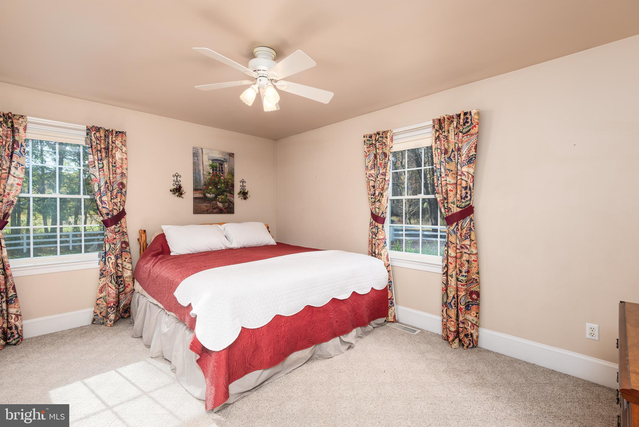 1002 Burrisville Road Centreville, MD 21617 - Photo 34 of 50 a bedroom with a bed and a window
