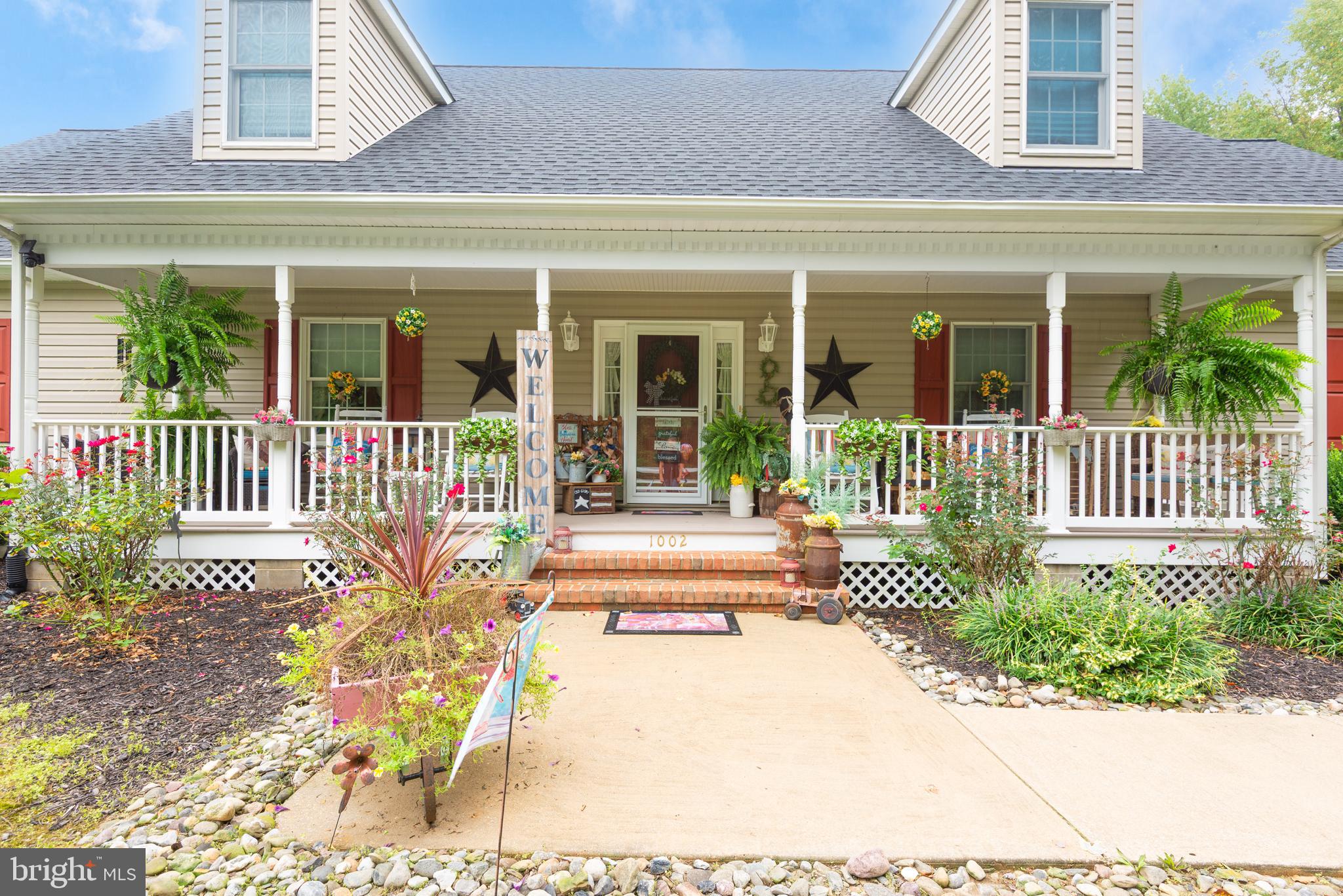1002 Burrisville Road Centreville, MD 21617 - Photo 4 of 50 a view of a house with a small yard and sitting area