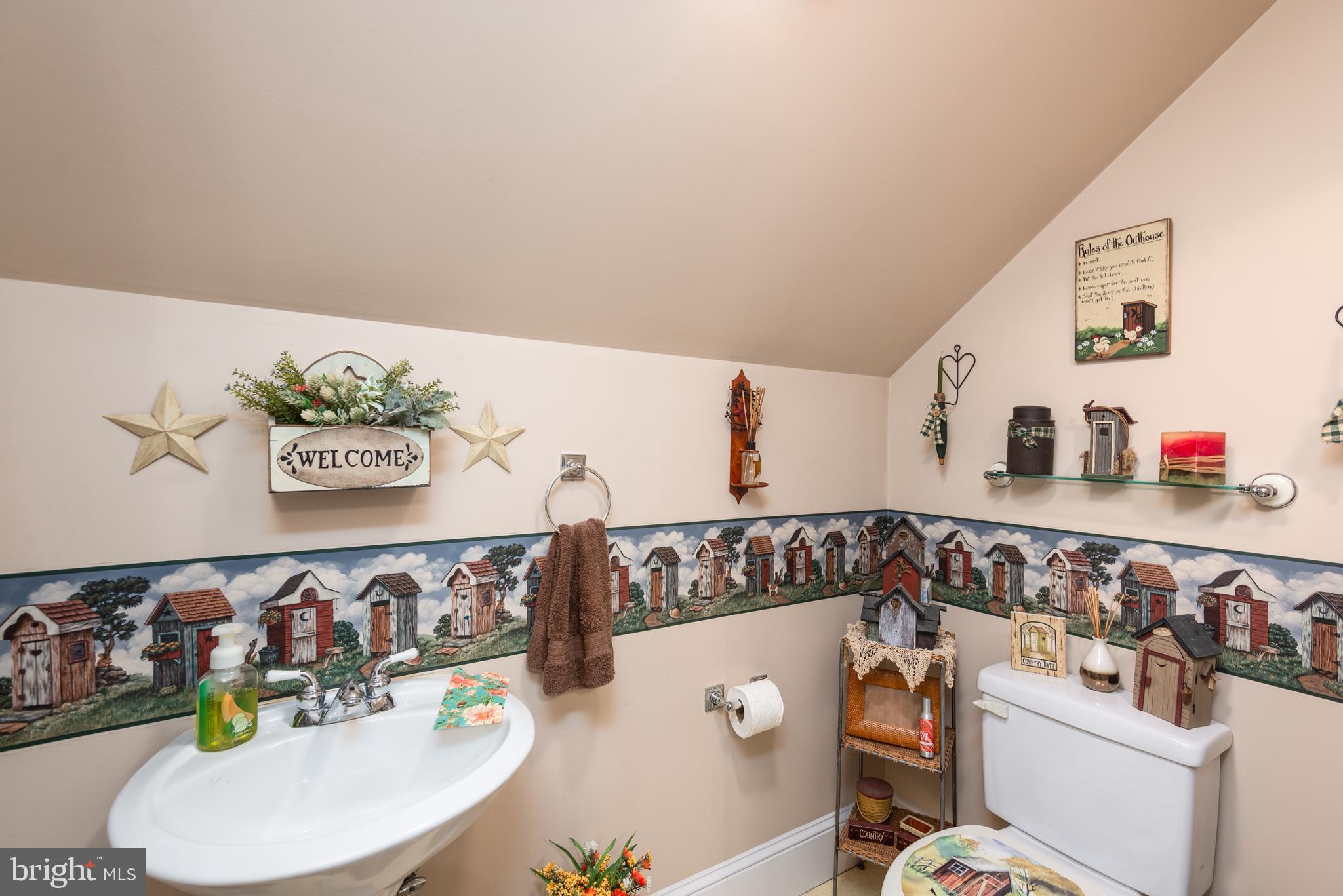 1002 Burrisville Road Centreville, MD 21617 - Photo 45 of 50 a bathroom with a bathtub and a sink