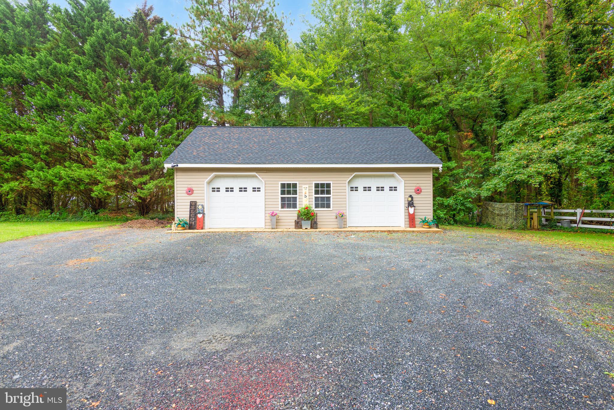 1002 Burrisville Road Centreville, MD 21617 - Photo 9 of 50 a view of a house with a big yard and large trees
