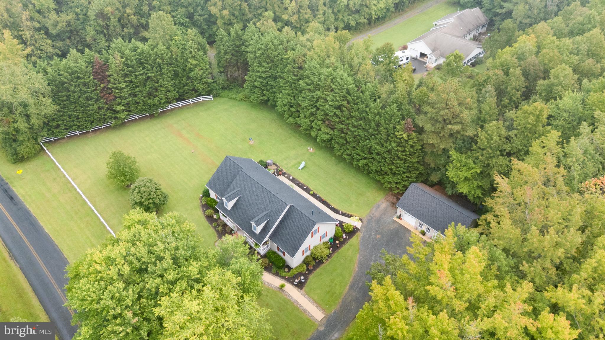 1002 Burrisville Road Centreville, MD 21617 - Photo 10 of 50 an aerial view of a house with swimming pool and garden