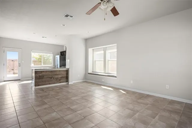 a view of an empty room with a window