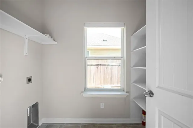 a bathroom with a bathtub and a window