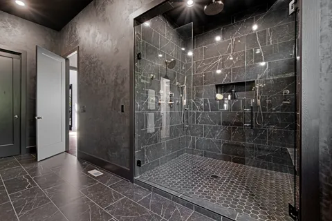 a bathroom with a double vanity sink and mirror
