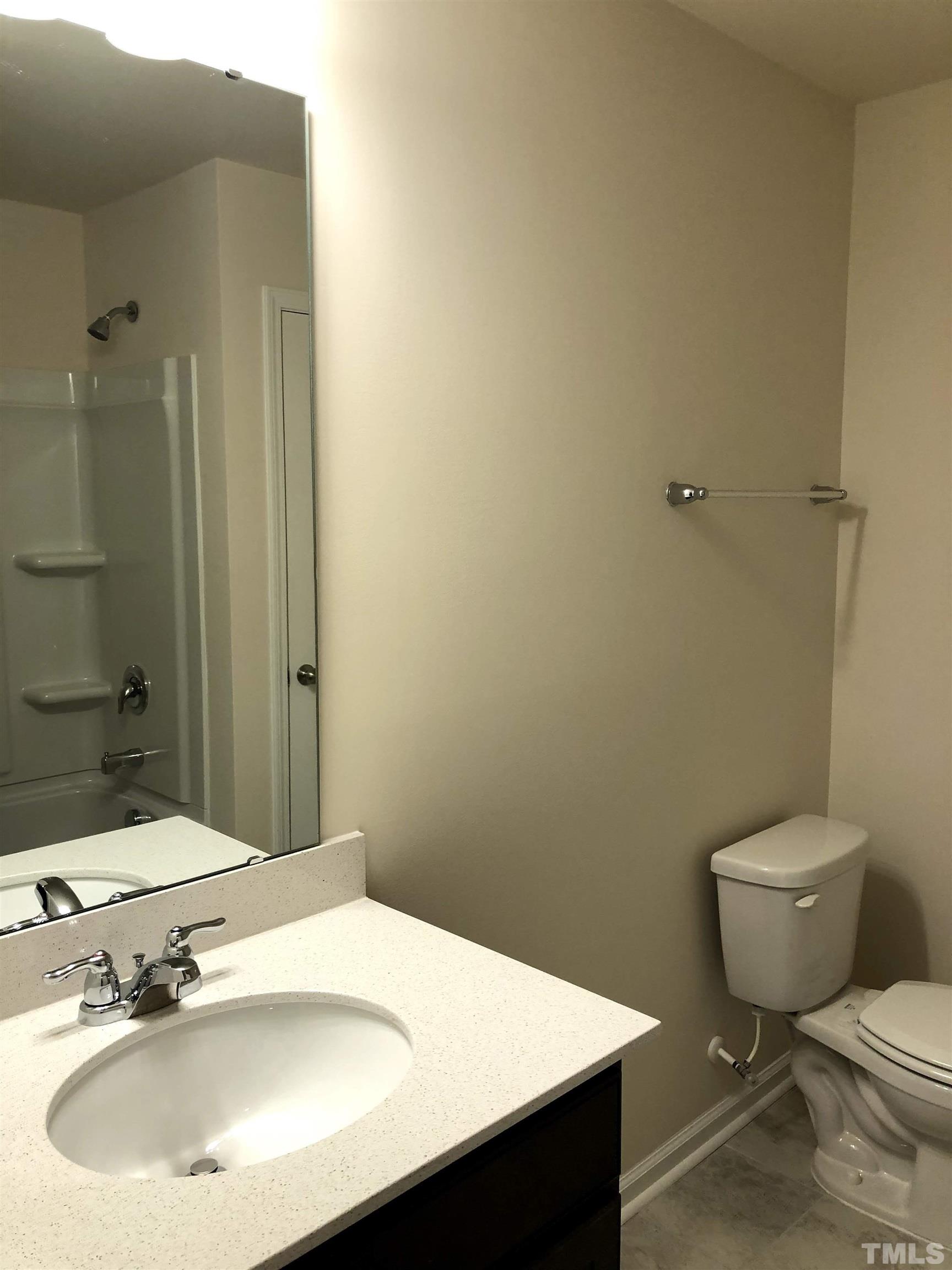 1215 Merrion Avenue Durham, NC 27703 - Photo 10 of 19 a bathroom with a sink toilet and shower