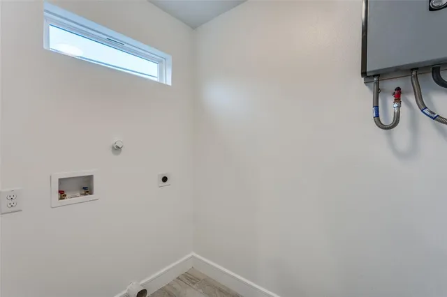 a bathroom with a shower and white door