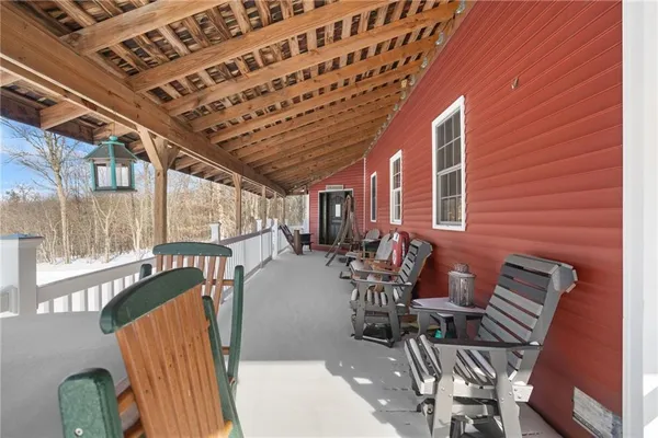 a view of a patio with table and chairs