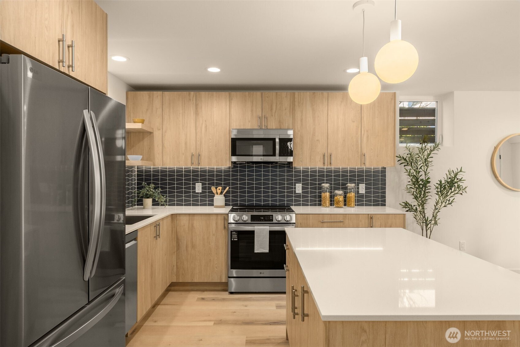 3916 South Juneau Street Seattle, WA 98118 - Photo 17 of 40 a kitchen with a refrigerator and a sink