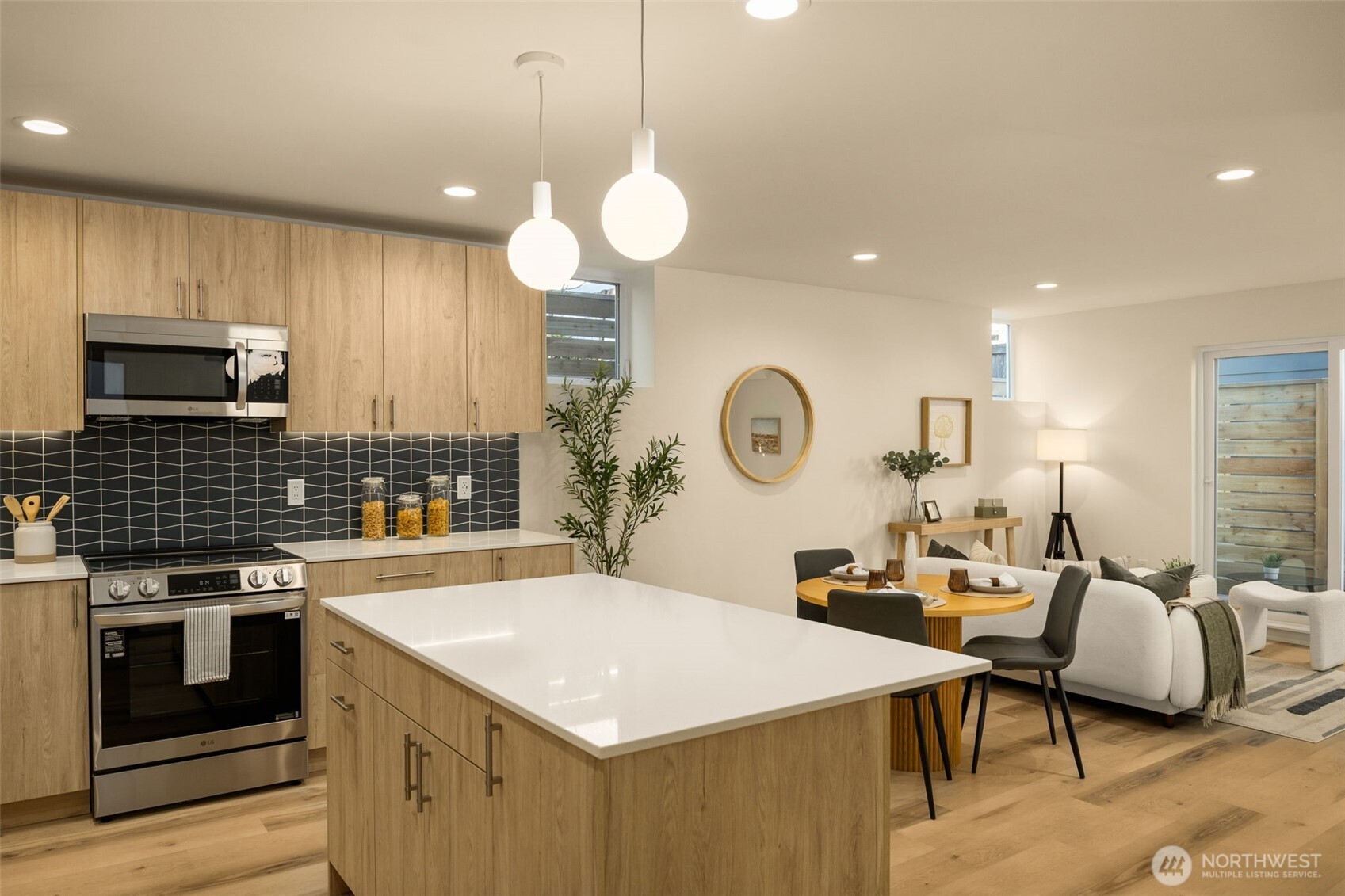 3916 South Juneau Street Seattle, WA 98118 - Photo 21 of 40 a large kitchen with a table and chairs