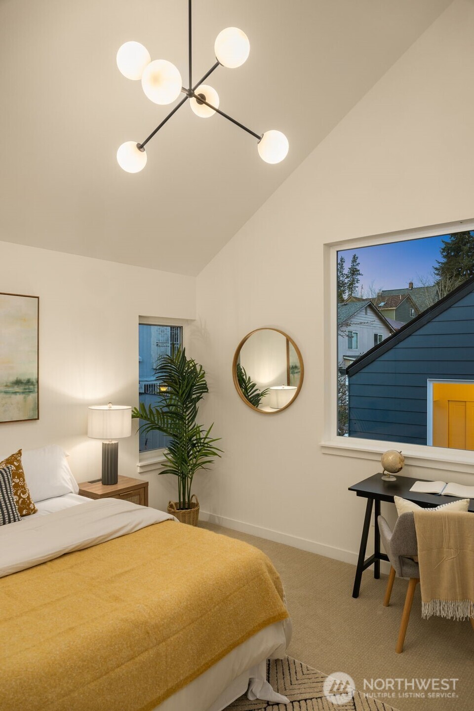 3916 South Juneau Street Seattle, WA 98118 - Photo 27 of 40 a bedroom with a bed and chandelier