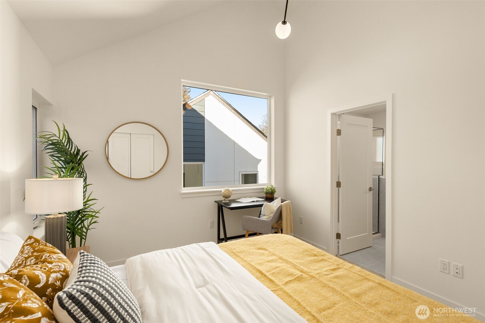 3916 South Juneau Street Seattle, WA 98118 - Photo 28 of 40 a bedroom with a bed and a mirror
