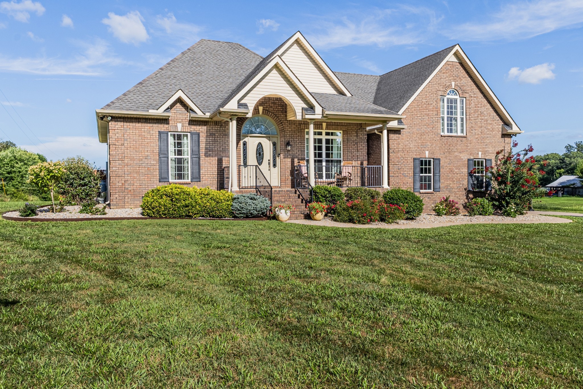 226 Ranch Road Portland, TN 37148 - Photo 1 of 54 a front view of a house with garden